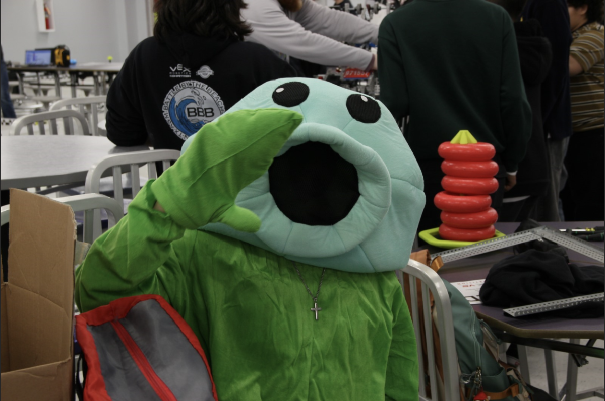 A Hanks student brings a costume from the game” Plants vs Zombies” to VEX competition at Franklin High School.